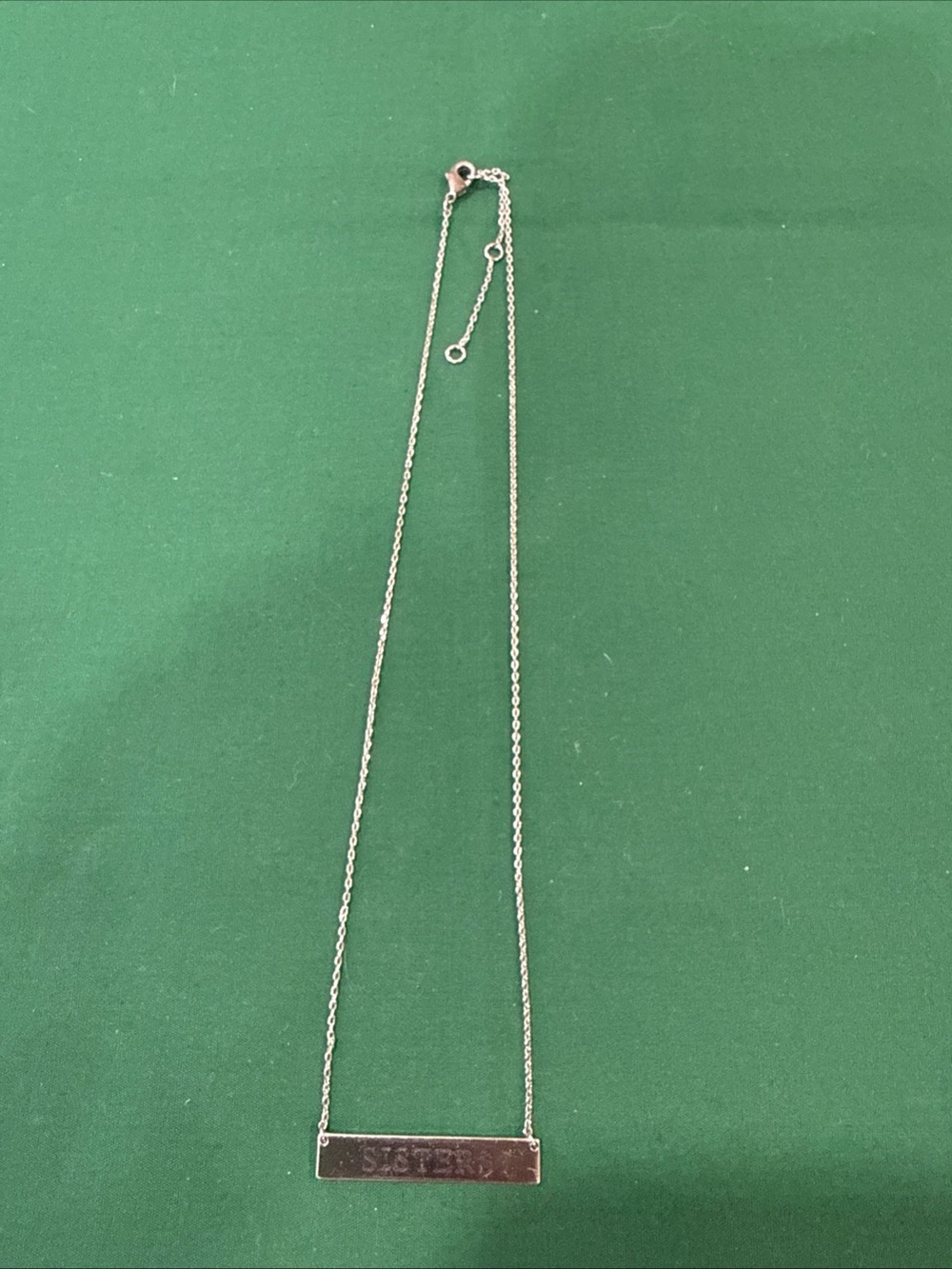 Horizontal SilverTone Bar Pendant Engraved With “Sisters”. 72F